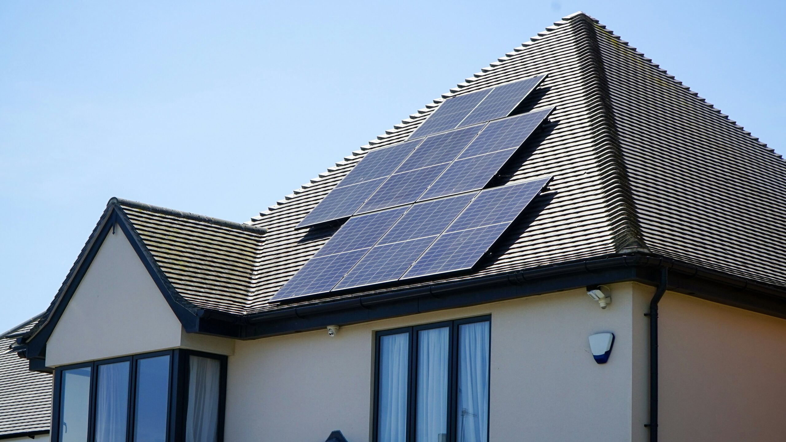 A modern chapter in the history of solar power: a solar panel system on a house roof